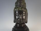 an image of a statue of a woman ' s head on a marble base