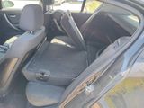 the interior of a car with the door open and the seats down