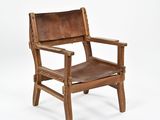 an old wooden chair with a brown leather seat on a white background