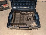 a tool box with tools inside of it on the floor