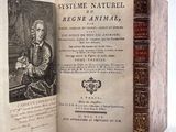 a book with a picture of a man sitting in a chair