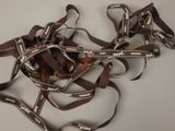 a pile of brown and white ribbons on a table