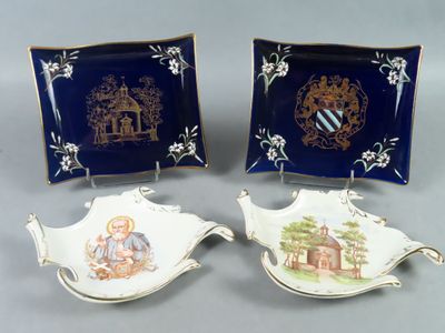 deux assiettes sur lesquelles figurent les portraits d'un garçon et d'une fille