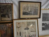 many framed pictures on the wall of a room