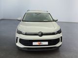 the front of a white volkswagen suv parked in a white room