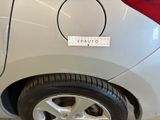 a white car with a sticker on the side of it