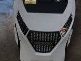 une petite machine qui se trouve dans un garage