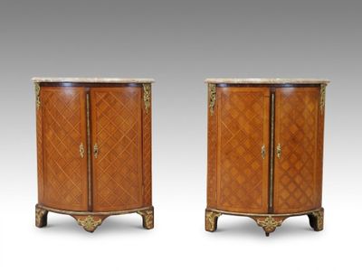 a pair of louis ii style bedside cabinets