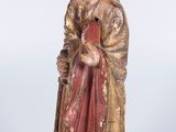 statue of a woman with a red robe and a gold crown