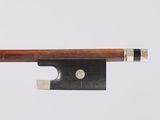 a close up of a violin bow on a white background
