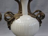 two vases that are sitting on a table