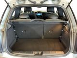 the back of a car with the trunk open and the seats down
