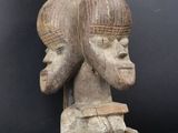 a close up of a statue of two people on top of each other