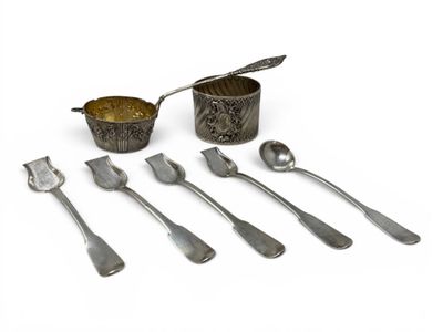 a set of silverware with spoons and spoons on a white surface