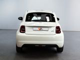 a white car that is parked in a room