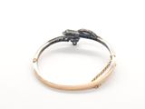a close up of a ring with a flower on it