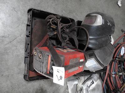 a picture of a welding helmet and other tools on a table