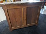 an image of a kitchen island with a granite top