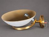 a white and gold bowl with a wire attached to it