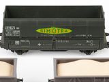 three toy train cars that are sitting on a table