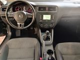 the interior of a car with a steering wheel and dashboard controls