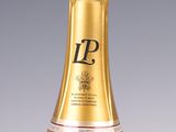 an image of a bottle of champagne sitting on top of a table