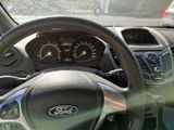 dashboard view of a car with a steering wheel and dashboard gauges