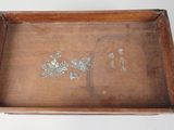 a wooden tray with a picture of a bird on it