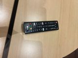 a remote control sitting on a table in a room