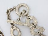 a pair of handcuffs and a pair of scissors on a table