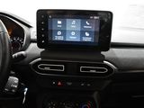 a car dashboard with a steering wheel and a display on it