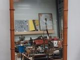 a mirror that is on the wall in a room