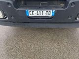 the front end of a truck with a number plate on it