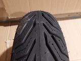 a close up of a motorcycle tire on the floor