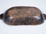 antique cast iron soap dish on white background with brown patt