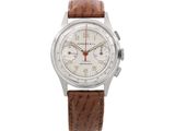 a close up of a watch on a white background