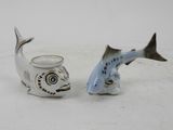 two salt and pepper shakers with a fish design on them