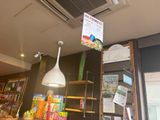 a sign hanging from the ceiling of a store