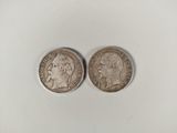 deux pièces d'argent, dont l'une représente la tête d'un homme et l'autre celle d'une femme