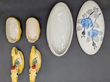 several pieces of pottery are displayed on a table
