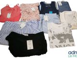 a lot of clothes that are sitting on a table