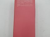 a box of facial cleanser sitting on a white surface