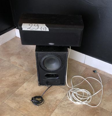 a speaker that is sitting on top of a speaker box