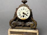 a clock that is sitting on top of a table