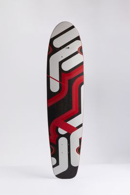 the skateboard has a red and black design on it