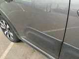 a close up of a car ' s door handle on the side of the car