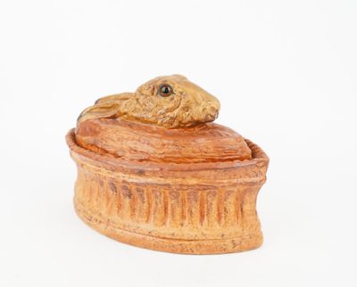 a small wooden box with a dog on top of it