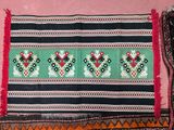 a rug with a pattern on it on a pink background