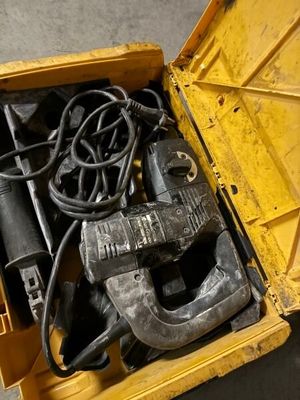 a yellow box with tools inside of it on the floor