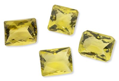 four square cut yellow sapphires on a white background